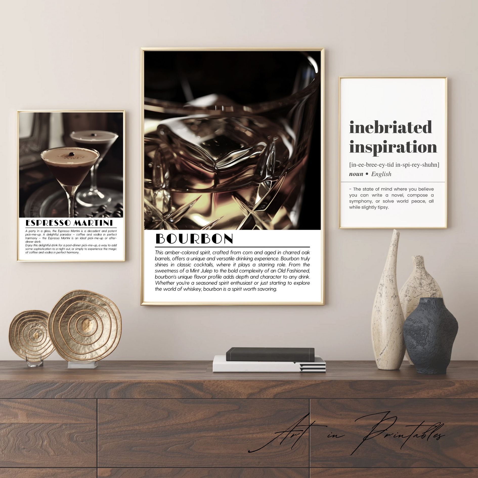 Three framed pictures on a wall above a wooden console table with decorative items.