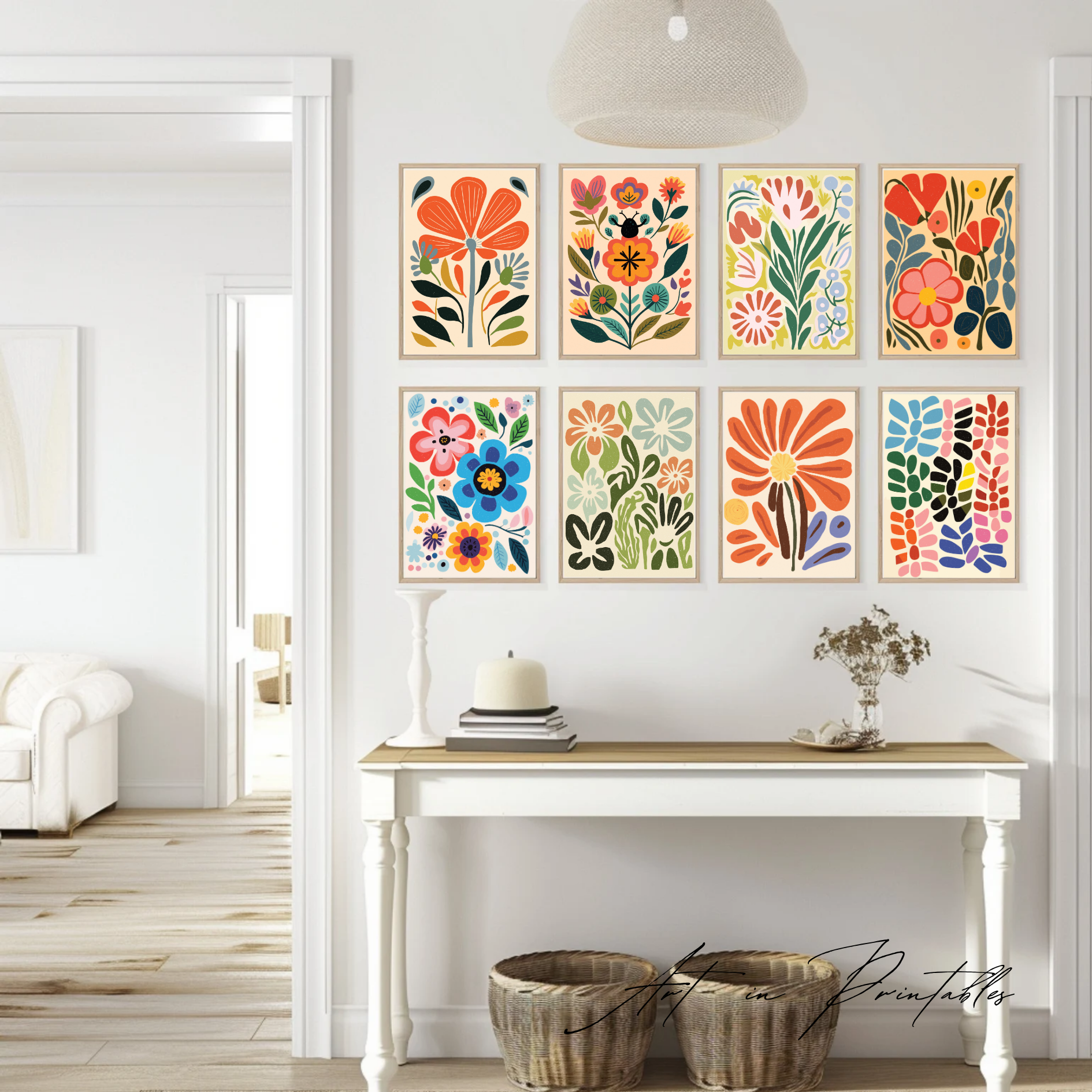 Colorful floral prints on a wall above a white console table.